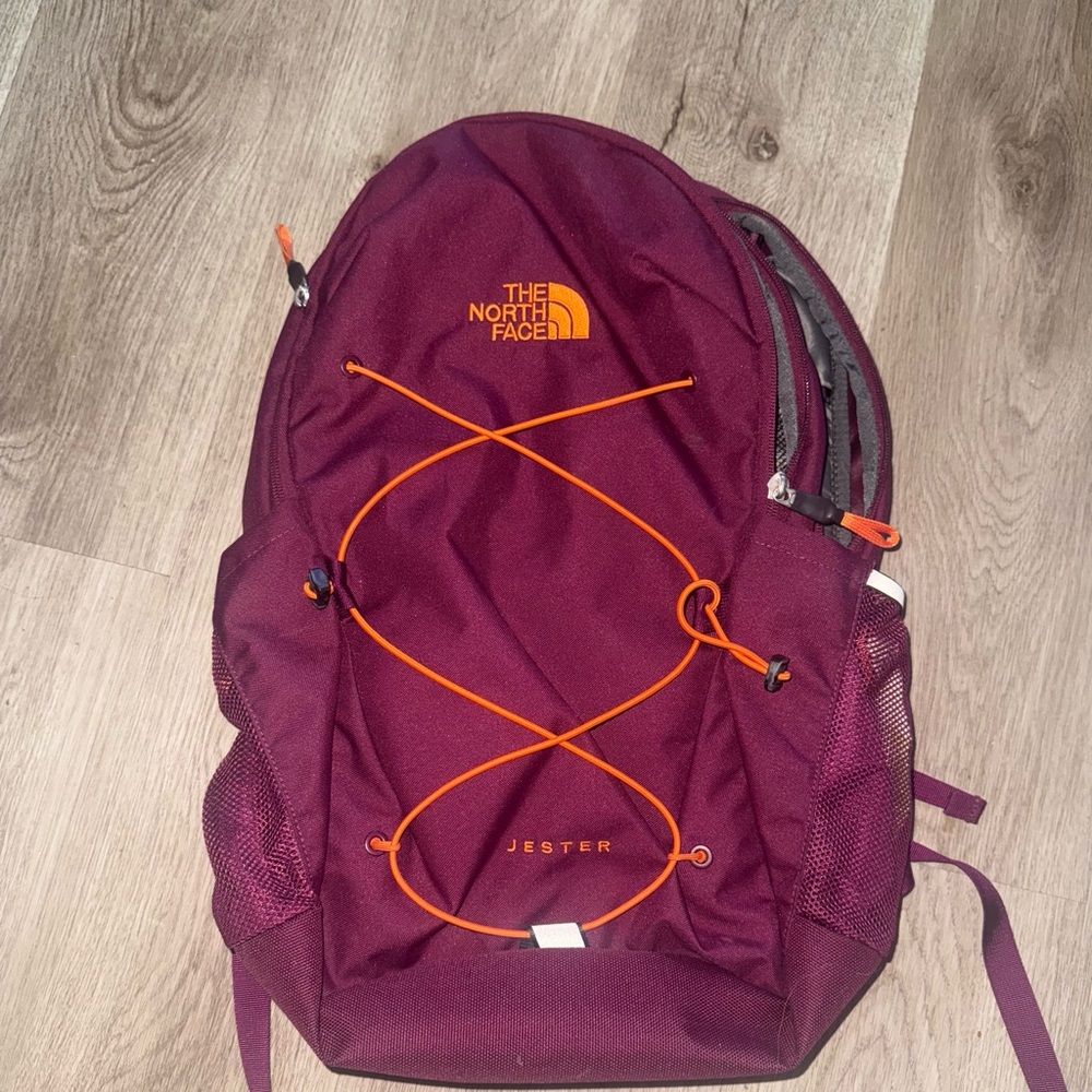 The North Face Maroon Backpack with Orange Details